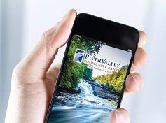 hand holding a mobile phone with the River Valley app displayed