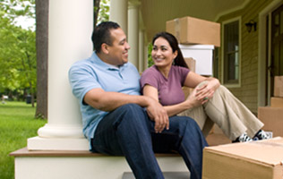 man and woman sitting on porch steps